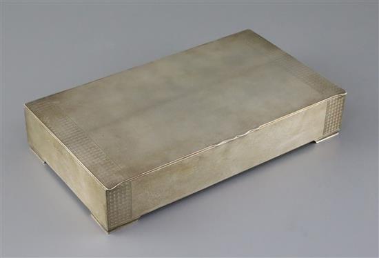 A George V engine turned silver rectangular cigarette box, Padgett & Braham Ltd, gross 41.5 oz.